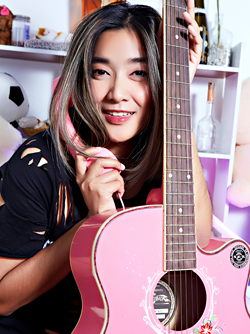 Asian Chick with her Pink Guitar